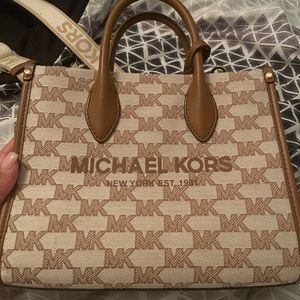 This is a gently used Mirella Small Logo Jacquard Crossbody bag.